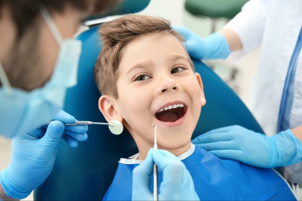 Dentist checking out child's teeth